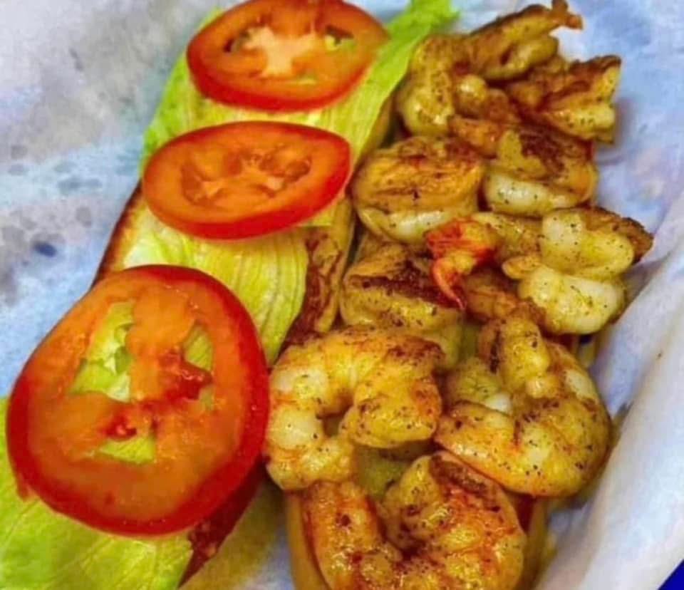 Cajun grilled shrimp on French bread with lettuce and tomato